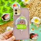 Phone case with a cute character design held by a hand, with a colorful background.